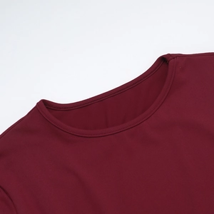 Detailed view of the crew neckline and premium stitching on this burgundy knit dress