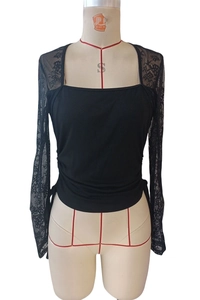 Close-up of elegant square neck black top with floral lace sleeves and side drawstrings