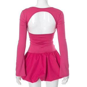 Detailed back view of hot pink long sleeve mini dress with oval cutout and puff hem