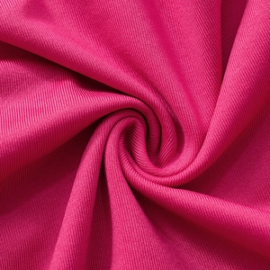 Close-up of hot pink ribbed knit fabric detail showing elastic texture and material