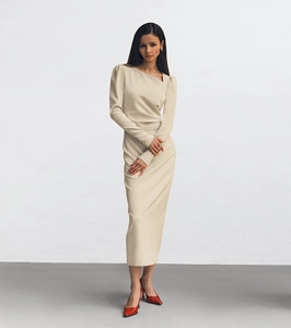 Detail of asymmetric neckline and puff sleeves on khaki slim fit midi dress