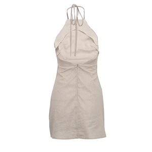 Detail view of the backless beige halter dress showing neck ties and zipper closure