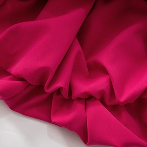Detail of rose pink chiffon fabric texture with soft drapes for a sexy mini dress