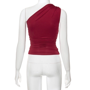 Detail view showing the ruched waist design of this slim fit burgundy one shoulder top