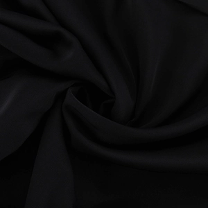 Macro shot of high-density black fabric texture with subtle silk luster for women's dress
