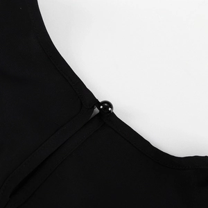 Detail of elegant black dress showing neck closure with button and loop fastener