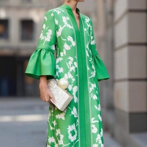 Elegant green long dress with white floral print, puff sleeves and deep V-neckline