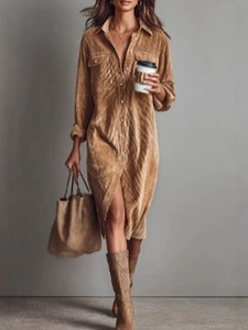 Detailed texture of mid-length corduroy shirt dress with classic collar and front pockets