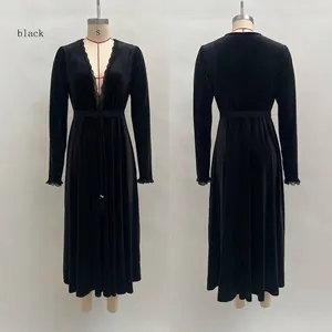 Front and back view of a black velvet dress with delicate lace V-neckline and sleeve trims