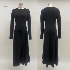 Detail of waist knot and pleated drapes on this black long sleeve wrap maxi dress