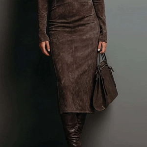 Detailed view of women brown suede texture long sleeve top and matching midi skirt set
