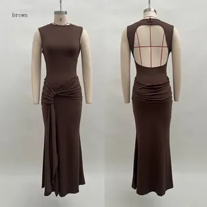 Detail of backless cut-out and ruched twist knot on brown sleeveless maxi dress
