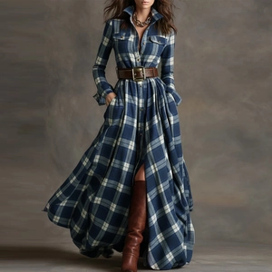 Detail view of long-sleeve blue plaid shirt dress with brown leather belt and slit detail