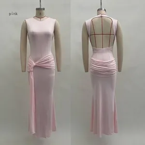 Detail of pink sleeveless dress showing side knot pleats and hollow back design
