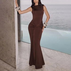 Detailed view of the elegant twist-knot ruched waist on a brown sleeveless maxi dress