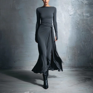 Detail of grey slim fit dress featuring a twist waist design and long sleeves with thumbholes
