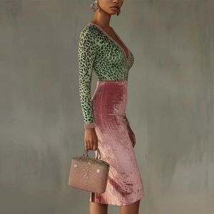 Slim leopard print V-neck top paired with a high-waist pink velvet midi skirt set