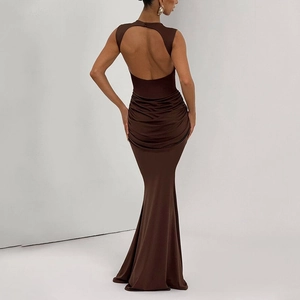 Detailed back view of sleek open back dress with ruched waist and fisheye hem design