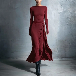 Detail view of burgundy long sleeve dress with waist knot, side slit and thumbholes