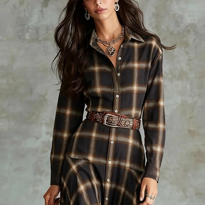 Detail of vintage plaid shirt dress with western metallic buckle belt and chain jewelry