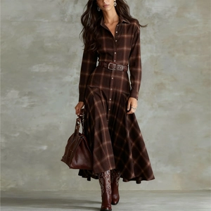 Brown plaid long sleeve shirt dress with a waist belt and embroidered leather boots