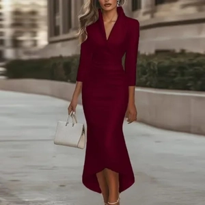 Detail of wine red satin dress featuring an asymmetrical hem and elegant V-neck design