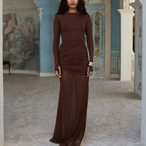 Detail showing sheer mesh hem and sleeve thumbhole on a slim fit brown backless maxi dress