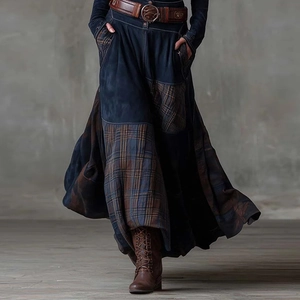 Detail view of vintage patchwork maxi dress with dark blue fabric and brown plaid pockets