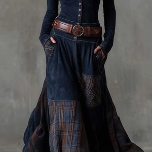 Detailed patchwork maxi skirt and vintage leather belt with ornate circular buckle