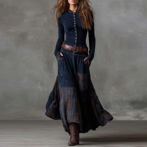 Detail view of vintage bohemian patchwork dress with plaid patterns and leather belt