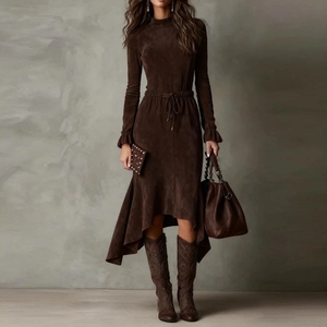 Detail of long sleeve dress showing brown suede fabric texture and waist tie design