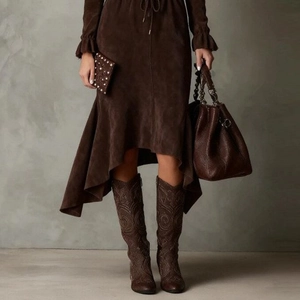 Detail of drawstring waist and ruffled sleeves on a brown suede texture dress