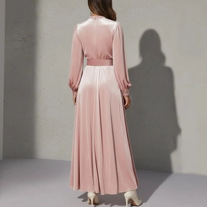 Pink velvet long sleeve maxi dress with cinched waist and pleated skirt back view
