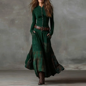 Detail of vintage patchwork maxi dress featuring green velvet bodice and plaid hemline