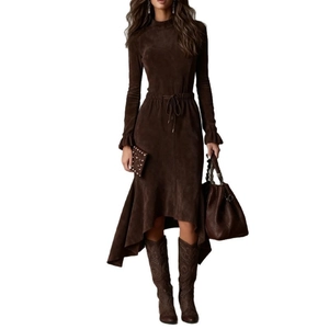 Detail of brown faux suede dress featuring drawstring waist and ruffled sleeve cuffs