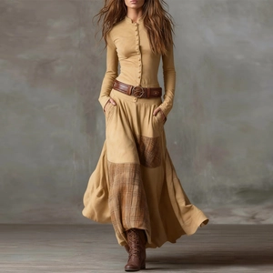 Detail of vintage patchwork maxi dress featuring high waist belt and plaid skirt inserts