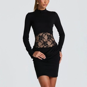 Detail of waist lace patchwork and floral patterns on black bodycon mini dress