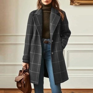 Detail of dark grey windowpane plaid wool coat with notched lapels and single-breasted buttons