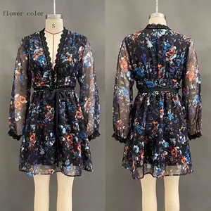 Detail of dark floral dress showing V-neck lace trim and chiffon sleeve texture