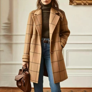 Detail shot of vintage plaid woolen coat featuring notched lapels and stylish side pockets