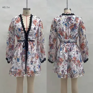 Front and back views of white floral long sleeve V-neck organza dress on a mannequin