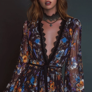 Detail of floral chiffon dress featuring deep V-neckline with delicate black lace trim