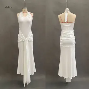 Front and back detail of white halter maxi dress featuring elegant waist pleats and streamers