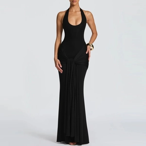 Detail of elegant black halter dress featuring a stylish knotted waist sash and slim fit