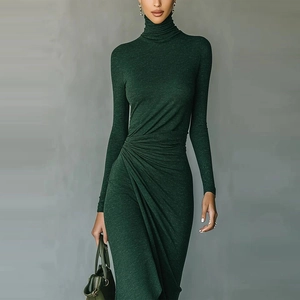 Detail view of dark green slim fit dress with elegant waist ruching and turtleneck