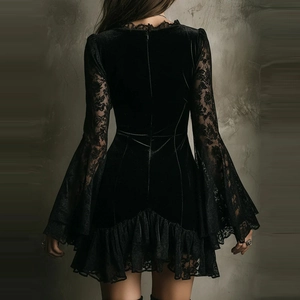 Detail of velvet dress back showing lace flared sleeves and ruffled lace hemline