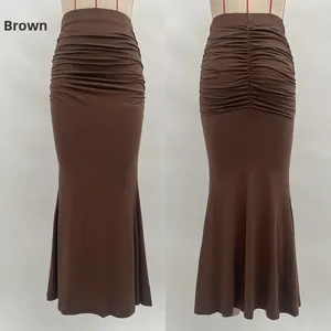 Detail view of brown high waist fishtail skirt with ruching and side pleated texture