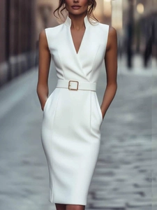 Detail of elegant white sleeveless midi dress featuring V-neckline and belt with metal buckle