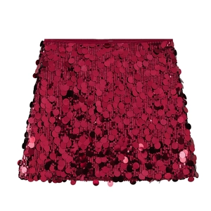 Close-up of vibrant magenta sequin mini skirt with shimmering circular discs and satin waist