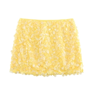 Detailed view of yellow sequin mini skirt with shimmering layered texture and high waist band